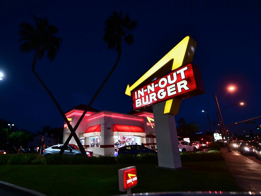 Drivers wait in the drive-thru line at an In-N-Out Burger restaurant in Alhambra, California, on August 30, 2018.