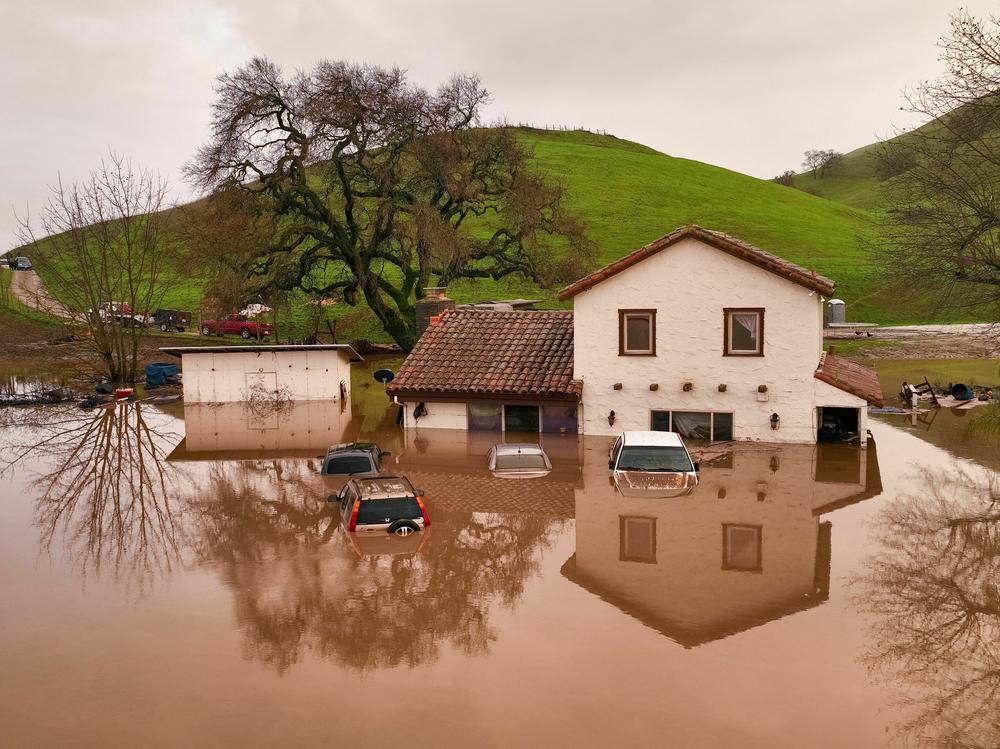 A house is partially underwater in Gilroy, Calif., on Monday.