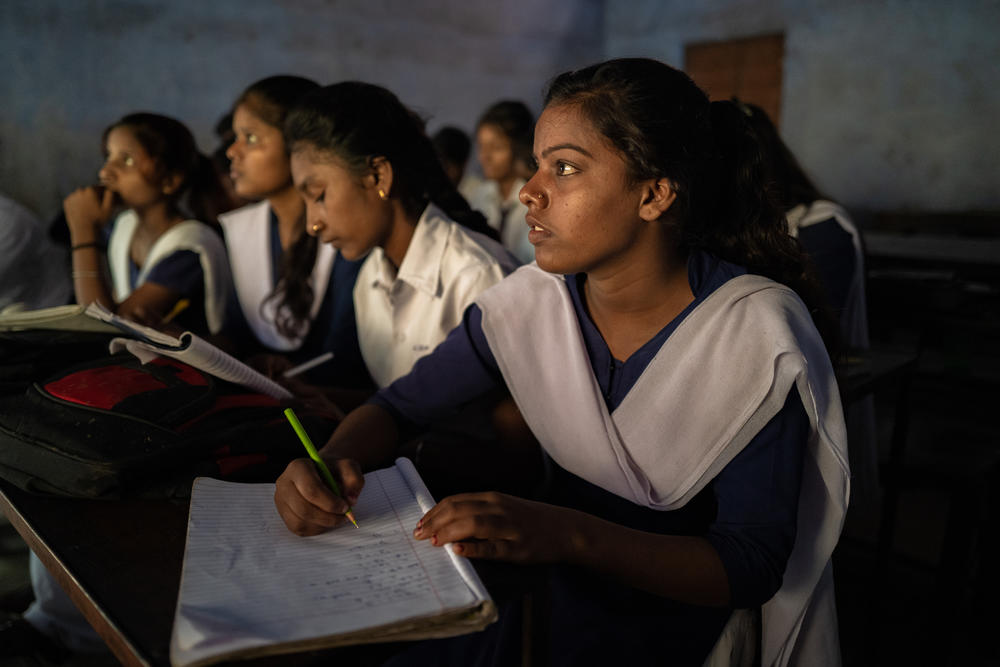 Anjali, one of the young people who scavenge for coal, attends a class at Karkend High School.