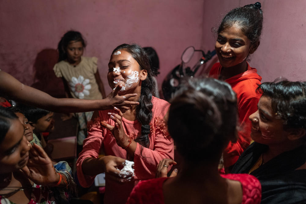 Radhika celebrates her 15th birthday with family and friends, including Suhani (15), Anjali (16), and Suman (21), in Ghansadih, July 2022. 