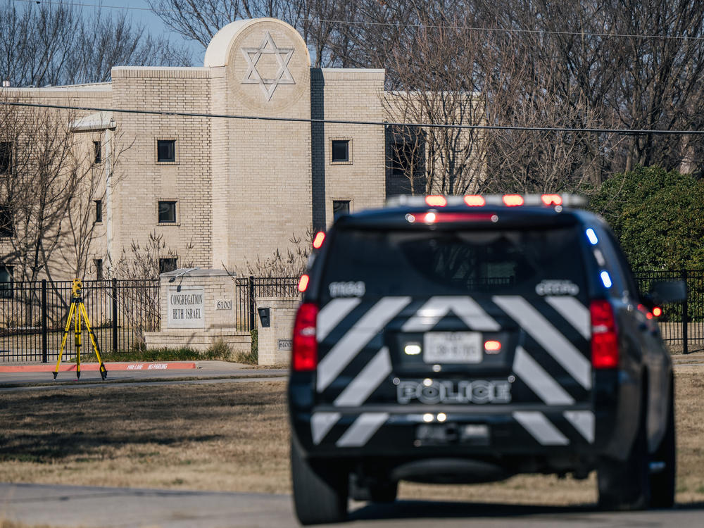 A police vehicle sits near the Congregation Beth Israel synagogue in Colleyville, Texas, on Jan. 16, 2022. Four people were held hostage at the synagogue for more than 10 hours by a gunman before being freed, one of a spate of antisemitic acts that took place last year.