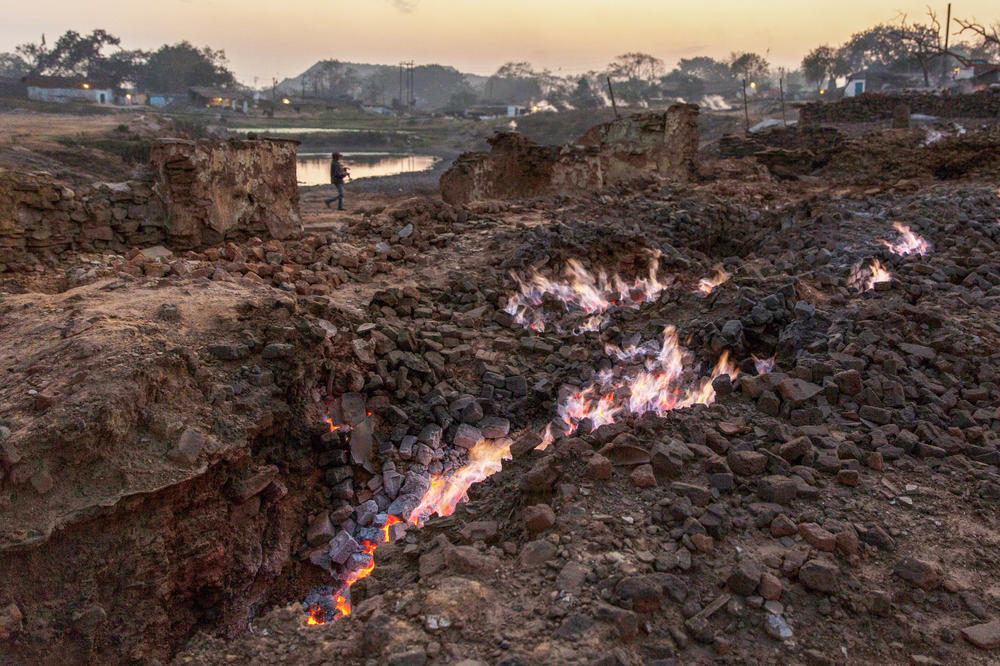 A 2016 view of an underground coal fire and the ruins of homes near the village of Laltenganj, on the edge of a mine in Jharia.