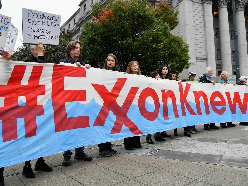 Climate activists protest on the first day of the ExxonMobil trial outside the New York State Supreme Court building on Oct. 22, 2019, in New York City. ExxonMobil was found not guilty of misleading investors about how climate change would affect its finances.