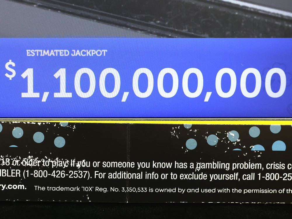 Lottery jackpots are soaring past the billion-dollar mark more frequently, thanks to higher interest rates and several rules changes. Here, a ticket machine displays the projected jackpot for a Mega Millions drawing in Chicago, in early January.