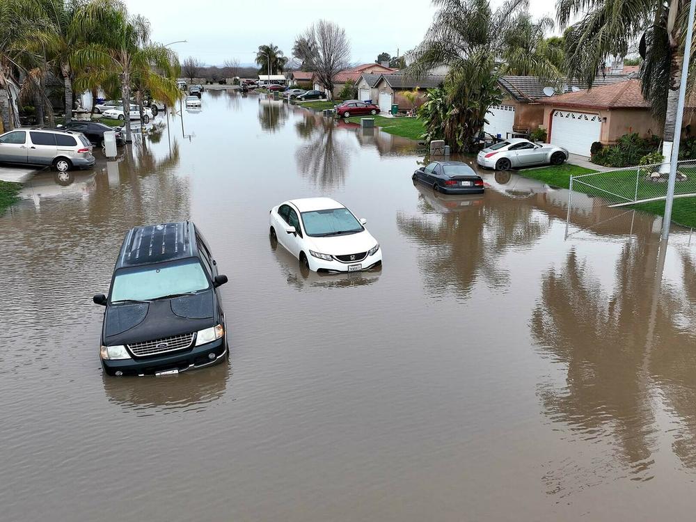 Roads and infrastructure are increasing being overwhelmed by heavier rainfall, like the California Central Valley town of Planada in January. Most states still aren't designing water systems for heavier storms.