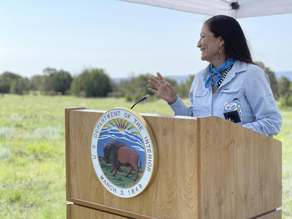 U.S. Interior Secretary Deb Haaland speaks at the Sabinoso Wilderness in Las Vegas, N.M., on July 17, 2021. The U.S. Department of the Interior has renamed five places in four states that had featured a racist term for a Native American woman.