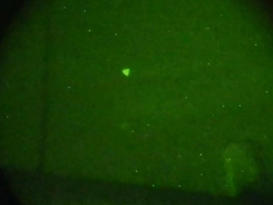 The Pentagon released this image of an Unidentified Aerial Phenomena (UAP) that was later determined to be a drone last year. The U.S. office that investigates UAP received hundreds of reports in 2022. This image was captured through night vision goggles during naval exercises off the U.S. East Coast in early 2022.