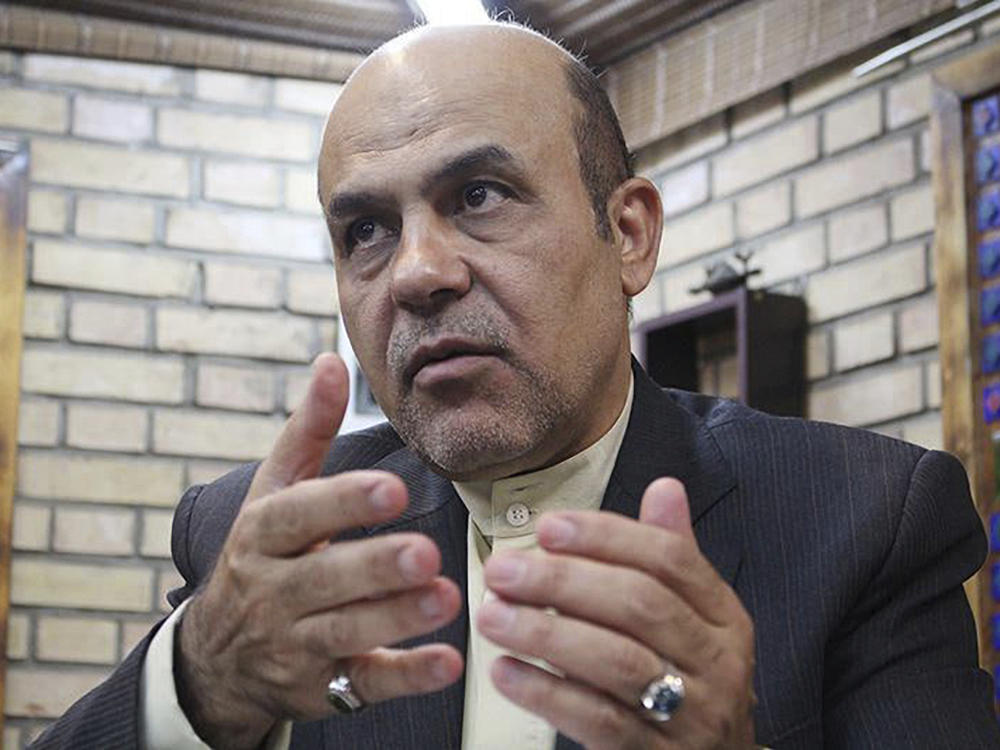 In this photo released by KhabarOnline News Agency on Sept. 18, 2019, Ali Reza Akbari speaks in an interview in Iran.