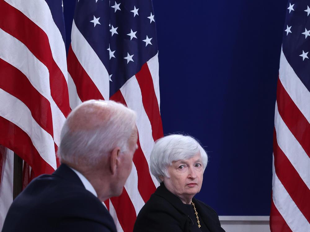 U.S. Treasury Secretary Janet Yellen listens to President Biden discuss the federal debt limit on Oct. 6, 2021, in Washington, D.C.