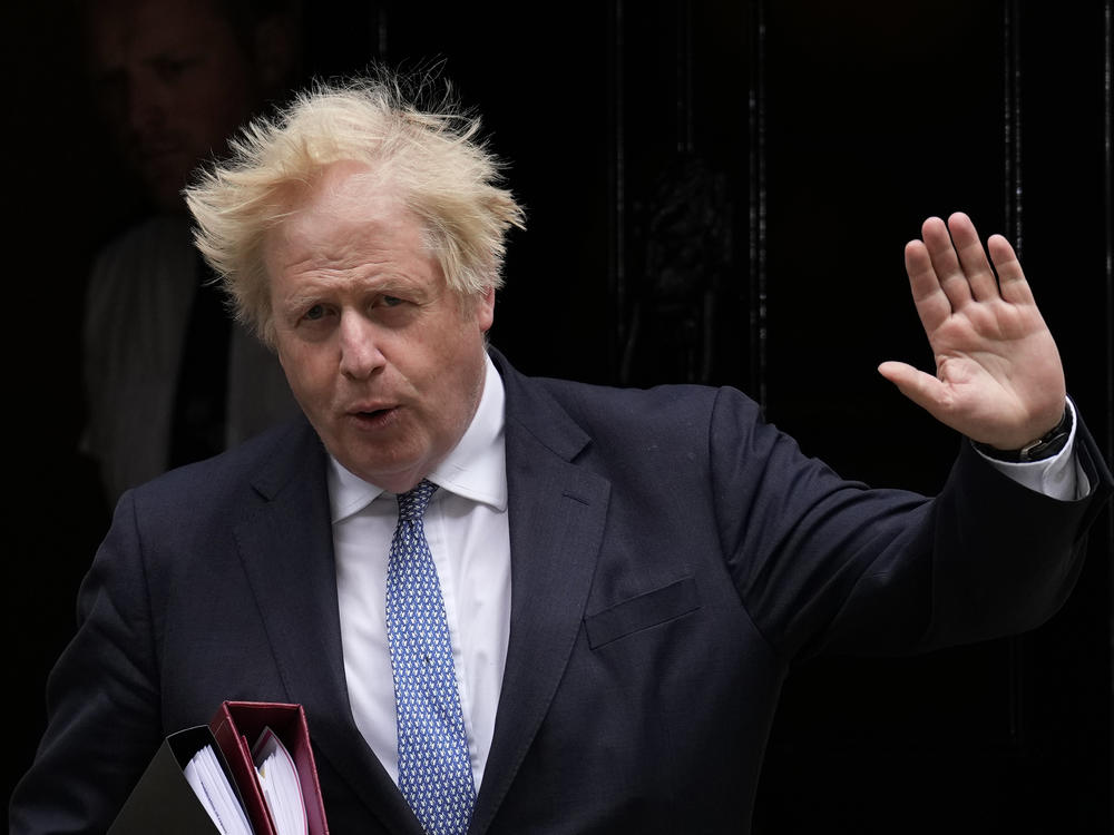 Then-British Prime Minister Boris Johnson leaves 10 Downing Street, in London, in May 2022. Johnson has signed a deal to write a memoir of his tumultuous time in office.