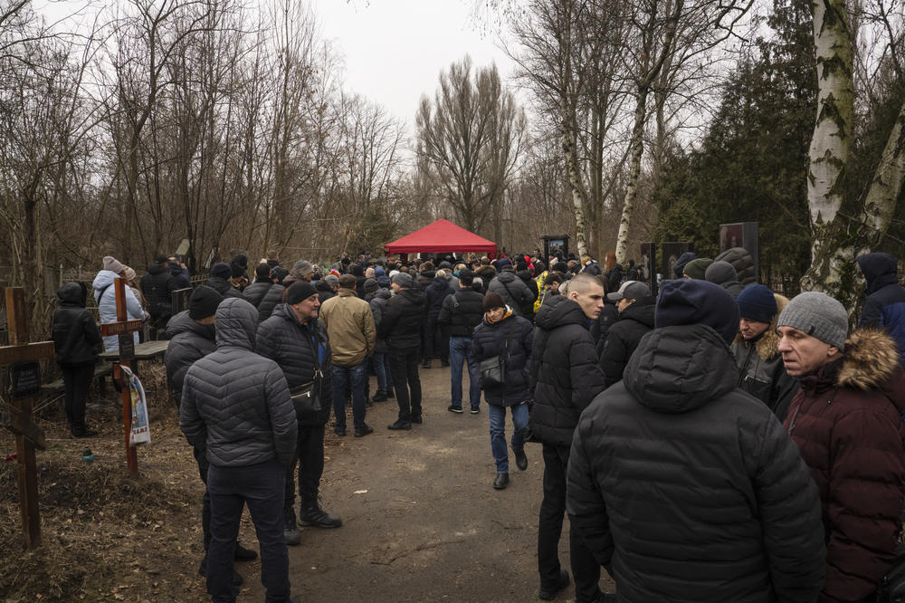 A crowd of hundreds attends the funeral of the beloved boxing coach.