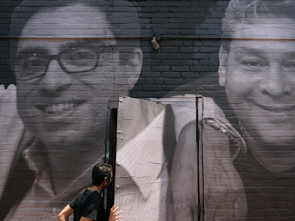 A mural in Washington, D.C. depicts Americans Siamak Namazi (left), who remains in Iran, and Jose Angel Pereira, who was released from Venezuela in October.