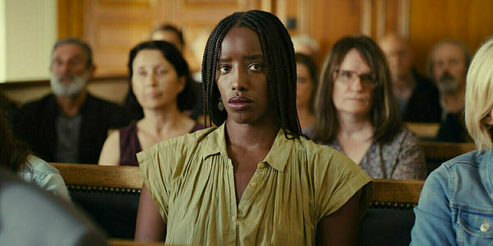 Kayije Kagame plays a writer covering the murder trial.