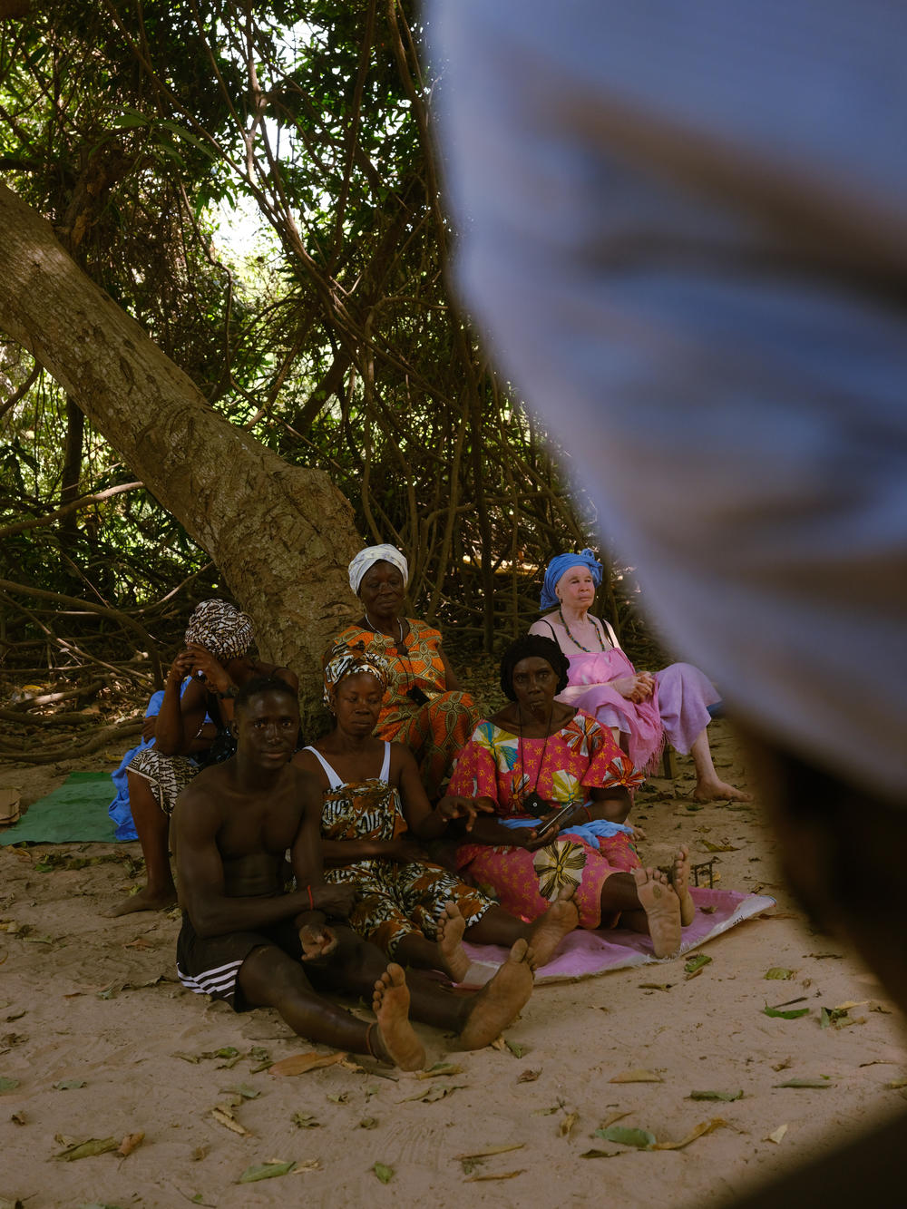 Patients with various mental and physical ailments wait for their appointments with the sacred forest priestesses in Casamance, Senegal, on Feb. 24, 2021.