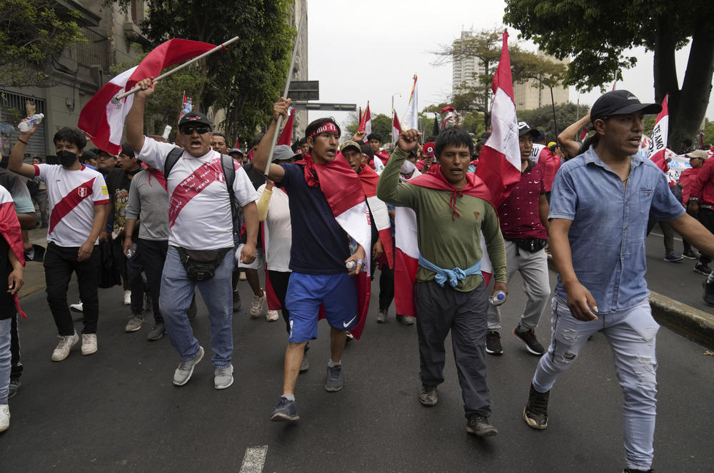 Anti-government protesters who traveled to the capital from across the country march against Peruvian President Dina Boluarte in Lima, Peru,  on Wednesday.