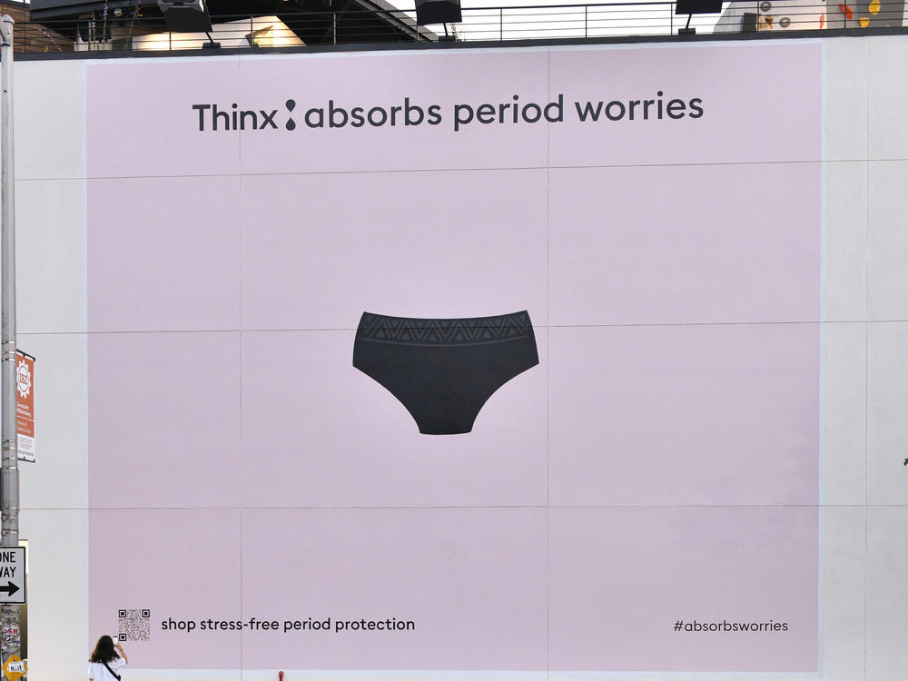 A Thinx billboard is pictured in New York City in September 2021. The company is accused of misleading consumers about the safety of its period underwear, but denies all allegations and admits no wrongdoing.