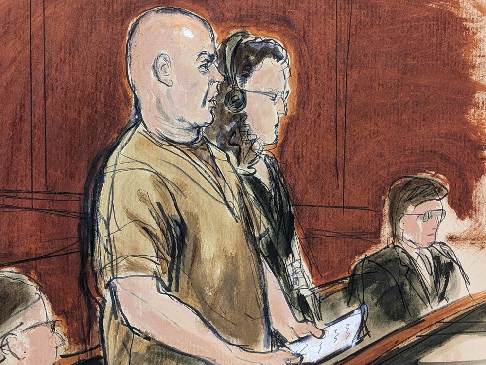 In this courtroom sketch, defendant Lawrence Ray (left) makes a statement during his sentencing in Manhattan federal court on Friday in New York, as his defense attorney, Peggy Cross-Goldenberg looks on.