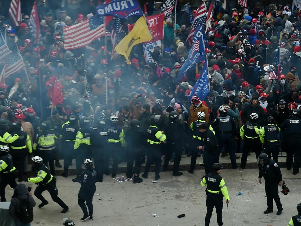 Police hold back supporters of US President Donald Trump as they gather outside the US Capitol's Rotunda on January 6, 2021, in Washington, DC.