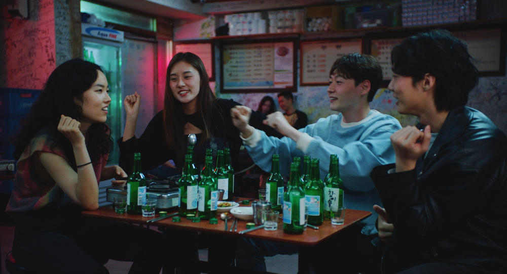 Freddie (Park Ji-Min) entertains new friends in <em>Return to Seoul.</em>
