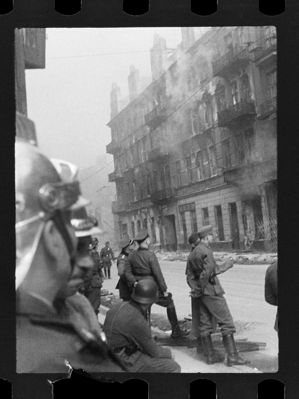 This handout negative dated on April 20, 1943, and taken by Polish firefighter Zbigniew Leszek Grzywaczewski shows houses being set on fire in the Warsaw Ghetto.