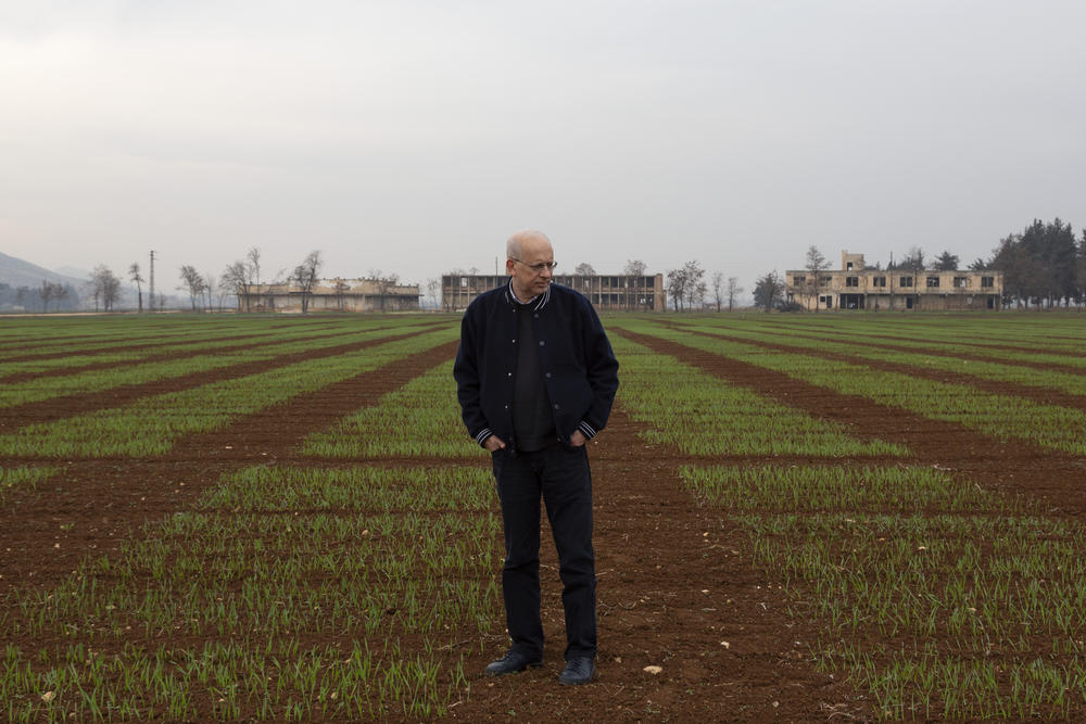 Hassan Machlab, a country manager with ICARDA in Lebanon, stands in the middle of a field with newly planted grains at the ICARDA research station, Dec. 21, 2022.