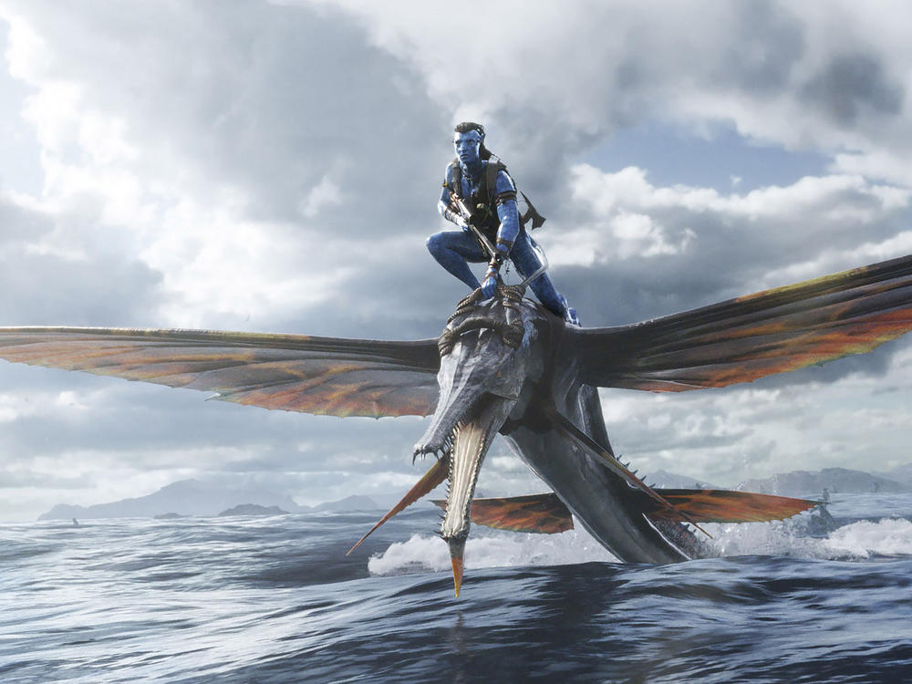 This image released by 20th Century Studios shows Jake Sully, portrayed by Sam Worthington, in 