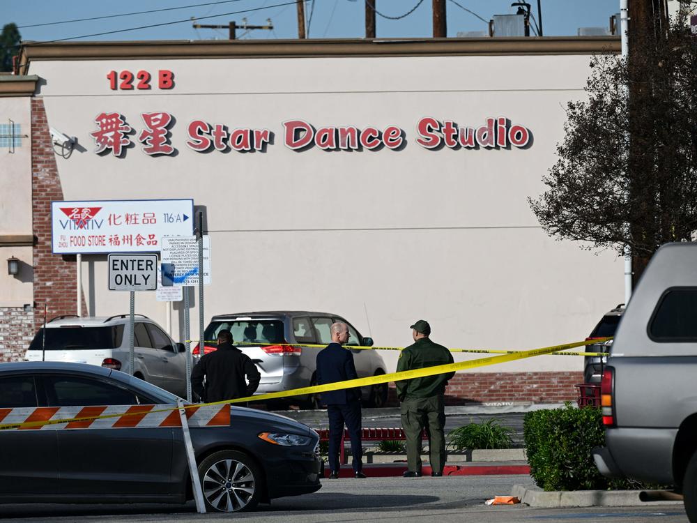 Investigators work at the scene of Saturday's mass shooting in Monterey Park, California.