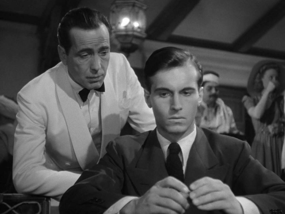 A screenshot from <em>Casablanca</em> showing Humphrey Bogart and Helmut Dantine.