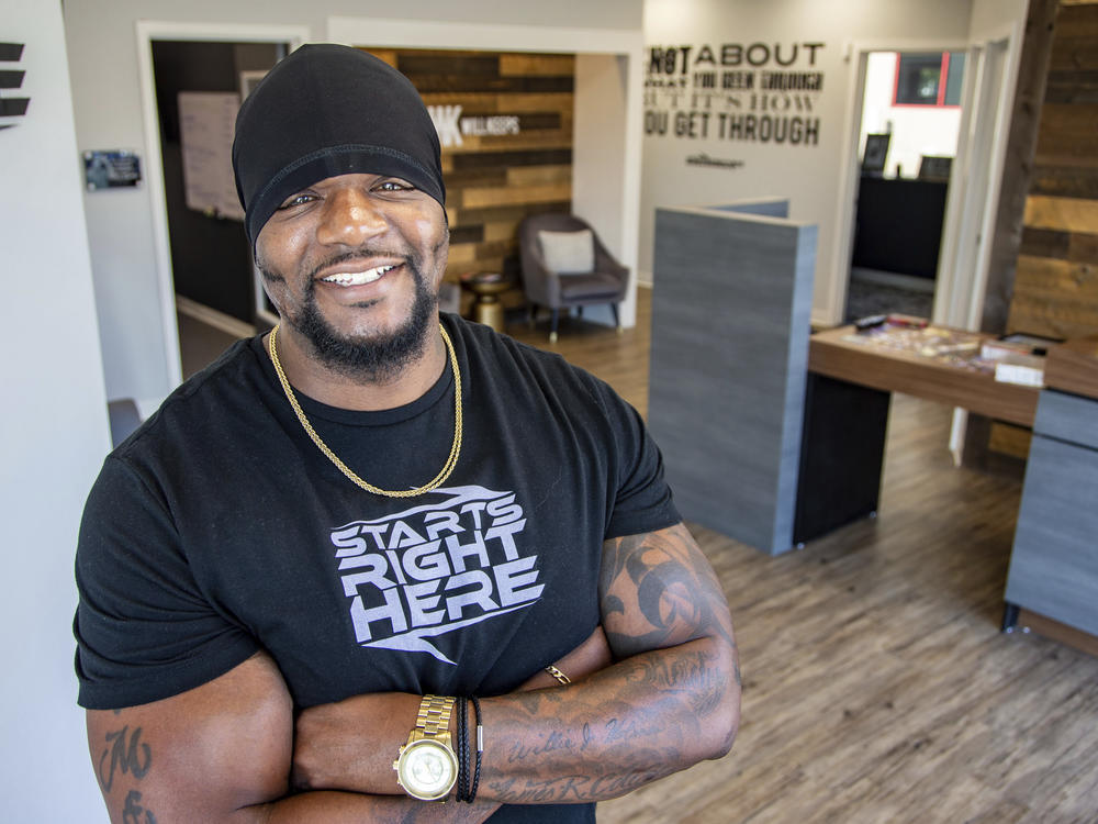 Will Holmes, a rapper who goes by the stage name Will Keeps, founder of Starts Right Here, stands for a photo at his organization in Des Moines, Iowa, Tuesday, July 13, 2021.