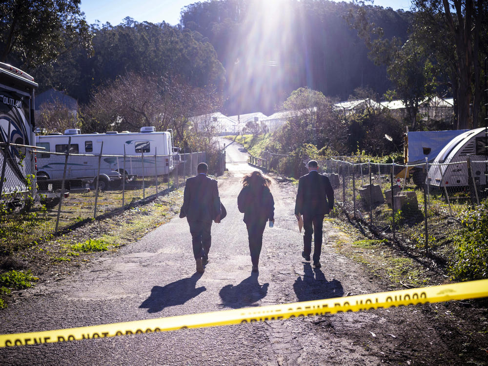 FBI officials walk toward the scene of the shooting at Mountain Mushroom Farm, on the outskirts of Half Moon Bay, on Jan. 24.