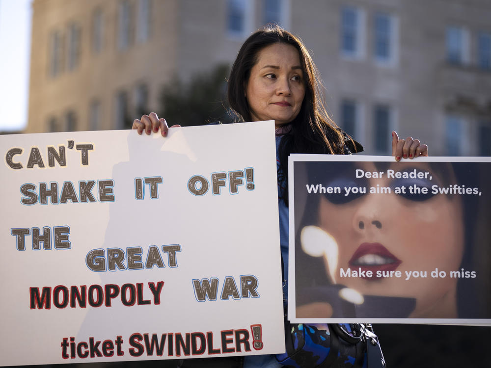 Amy Edwards rallied against Ticketmaster with Swift-themed signs outside the Capitol on Tuesday.