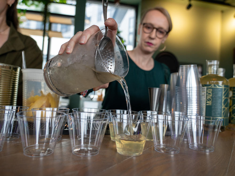 Festival volunteer Erin Petrey pours nonalcoholic martinis during bartender Derek Brown's master class at the Mindful Drinking Fest in Washington, D.C., on Jan. 21.