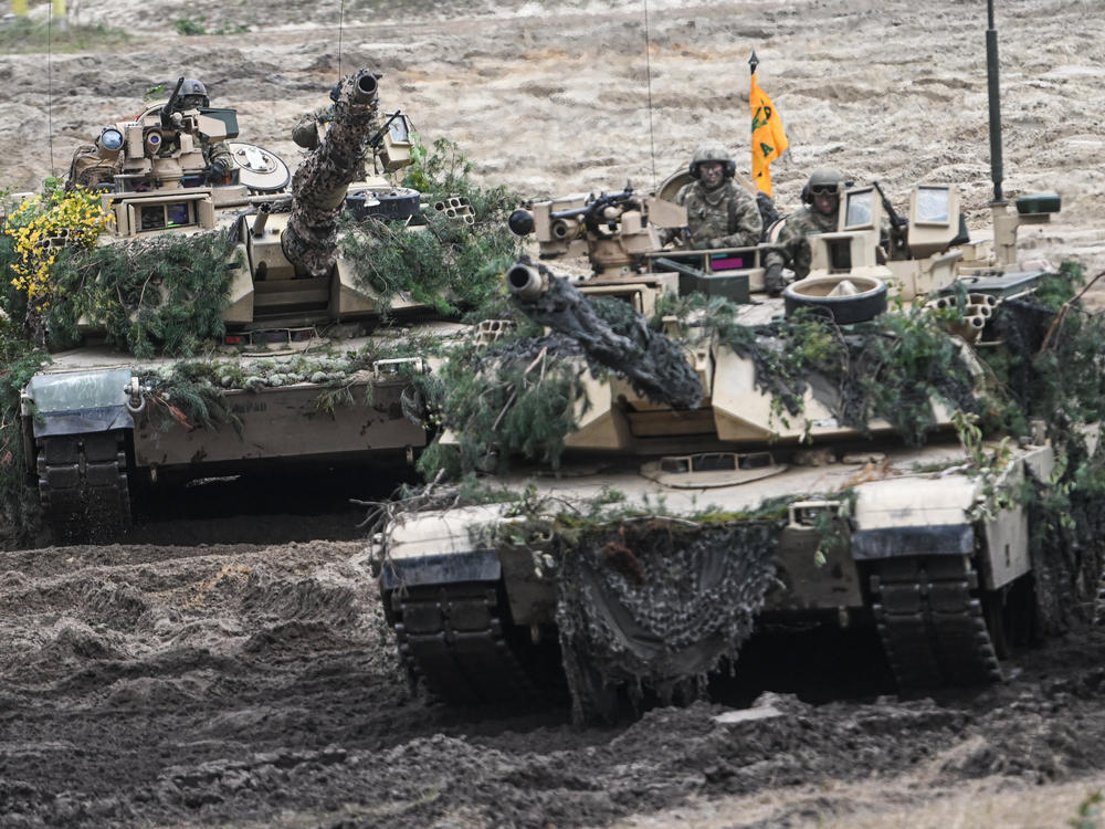 U.S. Abrams tanks participate in a live fire demonstration during training exercises in Poland in September 2022. President Biden announced Wednesday that the U.S. will be sending 31 Abrams tanks to Ukraine. Germany also said it will be sending tanks.