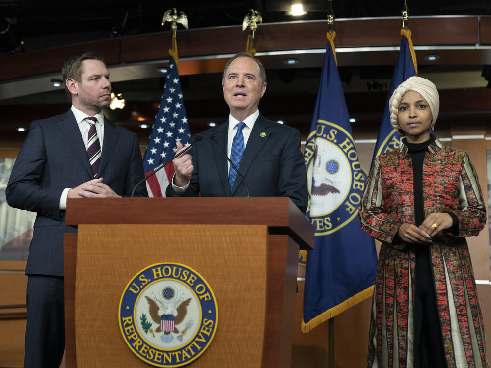 Rep. Adam Schiff, D-Calif., center, with Rep. Eric Swalwell, D-Calif., left, and Rep. Ilhan Omar, D-Minn., during a news conference on Capitol Hill in Washington on Wednesday.