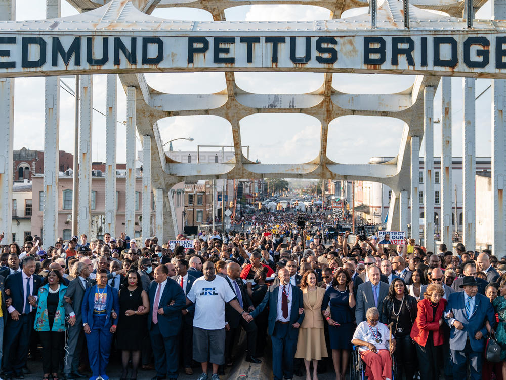 Vice President Harris (center) marches across the Edmund Pettus Bridge on March 6, 2022,  in Selma, Ala., to commemorate the 57th anniversary of Bloody Sunday.