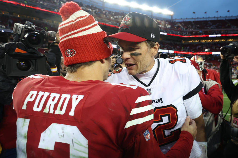 A 7th-round quarterback (Brock Purdy) and a 6th-round quarterback (Tom Brady) congratulate each other after a game in December.