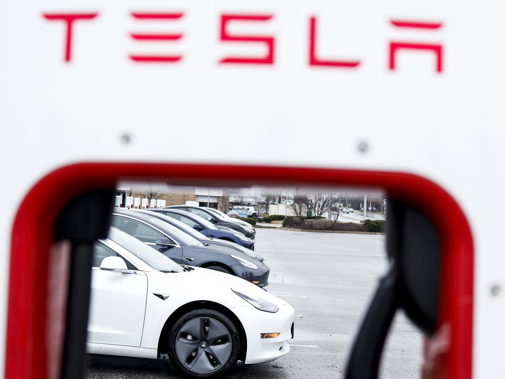 A Tesla charging station stands in a parking lot in Springfield, Va., on Jan. 17. The automaker decreased the prices of Teslas by up to 20%, a move seen as a reaction to competition in the global market for electric vehicles and rising inflation rates.