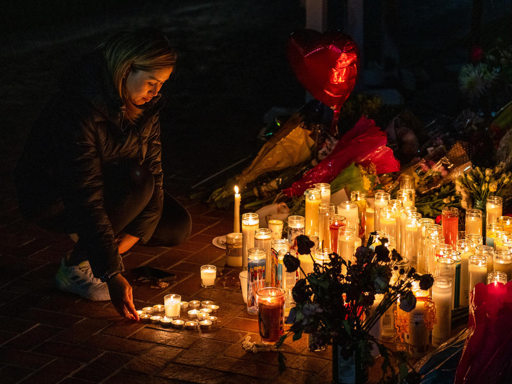 A new report from the U.S. Secret Service analyzes 173 mass attacks that took place in the country from 2016-2020. It comes just days after two shootings in California – in Monterey Park and Half Moon Bay – killed 18 people. Shown here is a mourner at a candlelight vigil for victims of the mass shooting at a dance studio in Monterey Park, Calif.