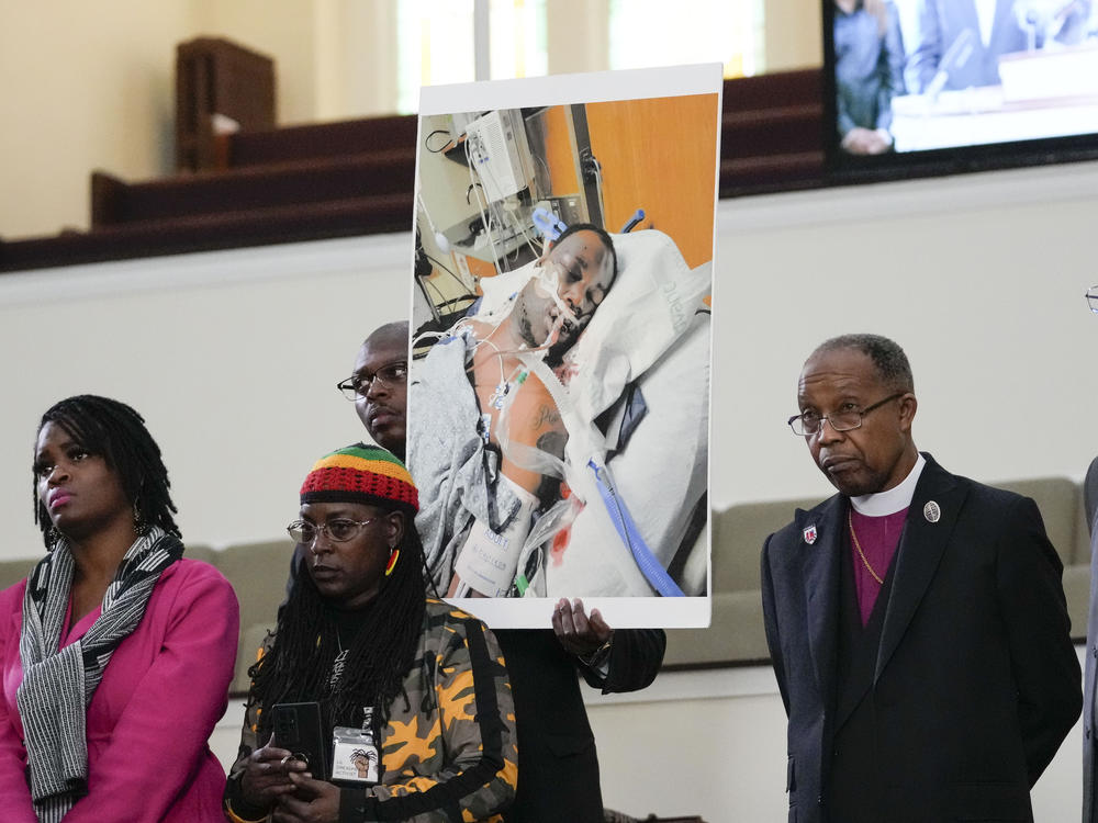 Family members and supporters hold a photograph of Tyre Nichols at a news conference in Memphis, Tenn., earlier this week.