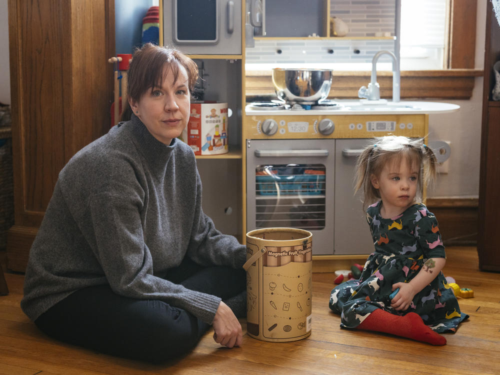 Brenna Kearney plays with her daughter, Joey, at home in Chicago. When Kearney was pregnant, she developed a rare type of preeclampsia and had to undergo an emergency cesarean section. Joey was discharged after a 36-day stay in the NICU.