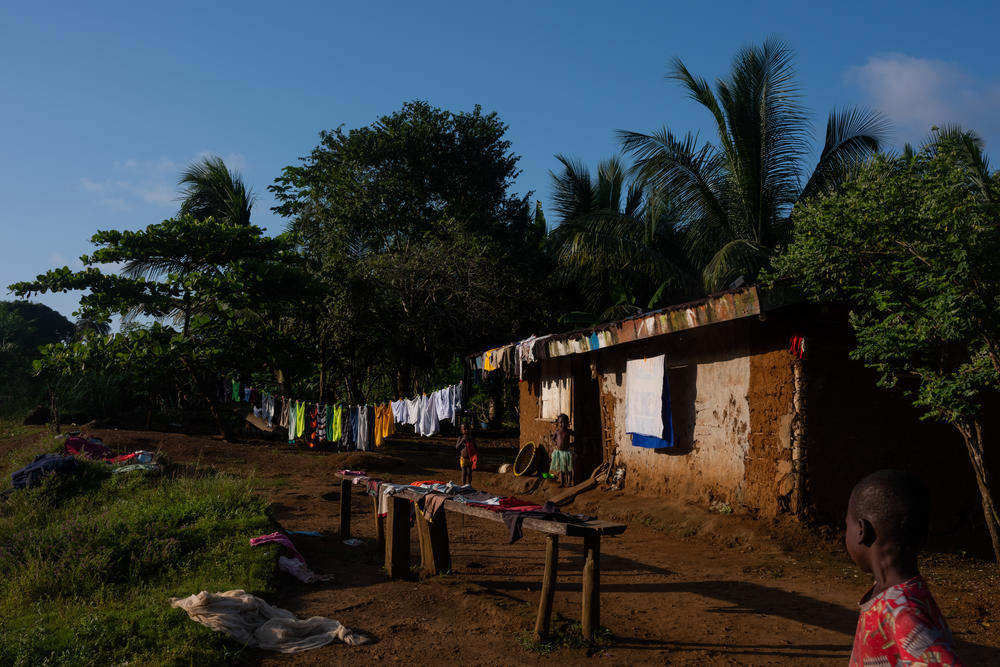 The residents of Barconie, Liberia, fish from the ocean on Nov. 16, 2022. A sacred lagoon close to the town is off-limits from being exploited.