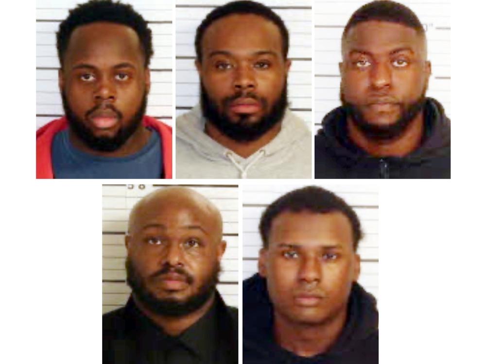 This combo of booking images provided by the Shelby County Sheriff's Office shows, from top row from left, Tadarrius Bean, Demetrius Haley, Emmitt Martin III, bottom row from left, Desmond Mills, Jr. and Justin Smith. The five former Memphis police officers have been charged with second-degree murder and other crimes in the arrest and death of Tyre Nichols.