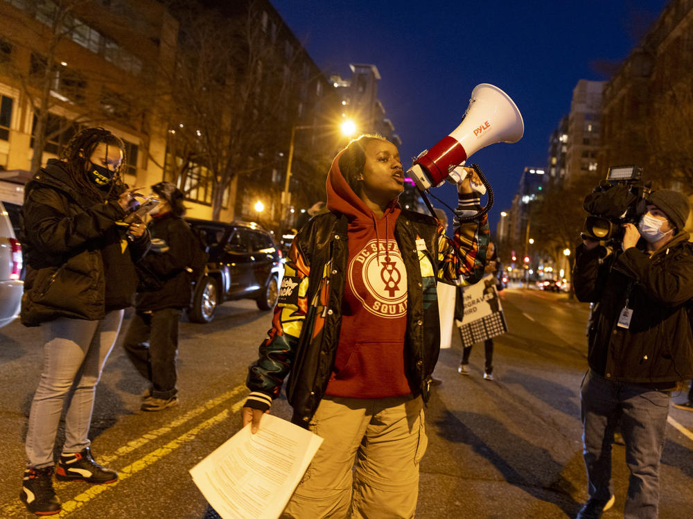 Nikki Charles of the activist groups Harriet's Wildest Dreams and the D.C. Safety Squad block part of K Street in Washington D.C. to protest the police killing of Tyre Nichols.