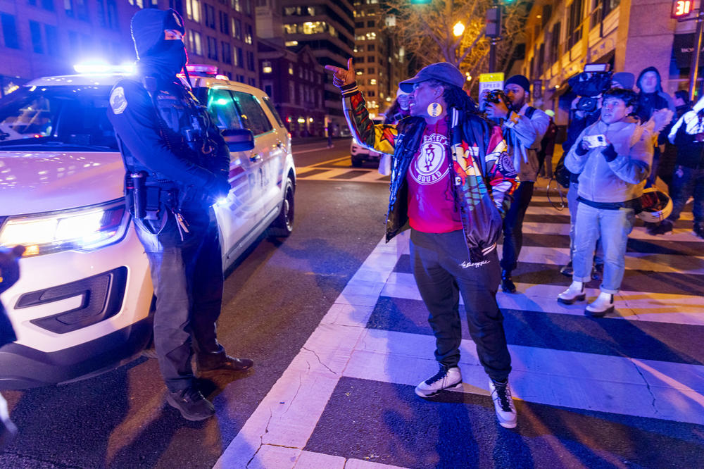 Nee Nee Taylor, co-founder of the abolitionist group, Harriet's Wildest Dreams, confronts a police officer in Washington D.C. during their demonstration on the night that the video of the killing of Tyre Nichols was released.
