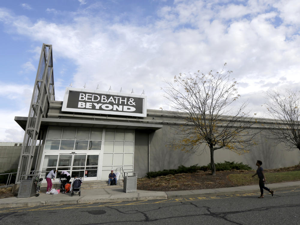 Shoppers stand outside a Bed Bath & Beyond store in New Jersey.