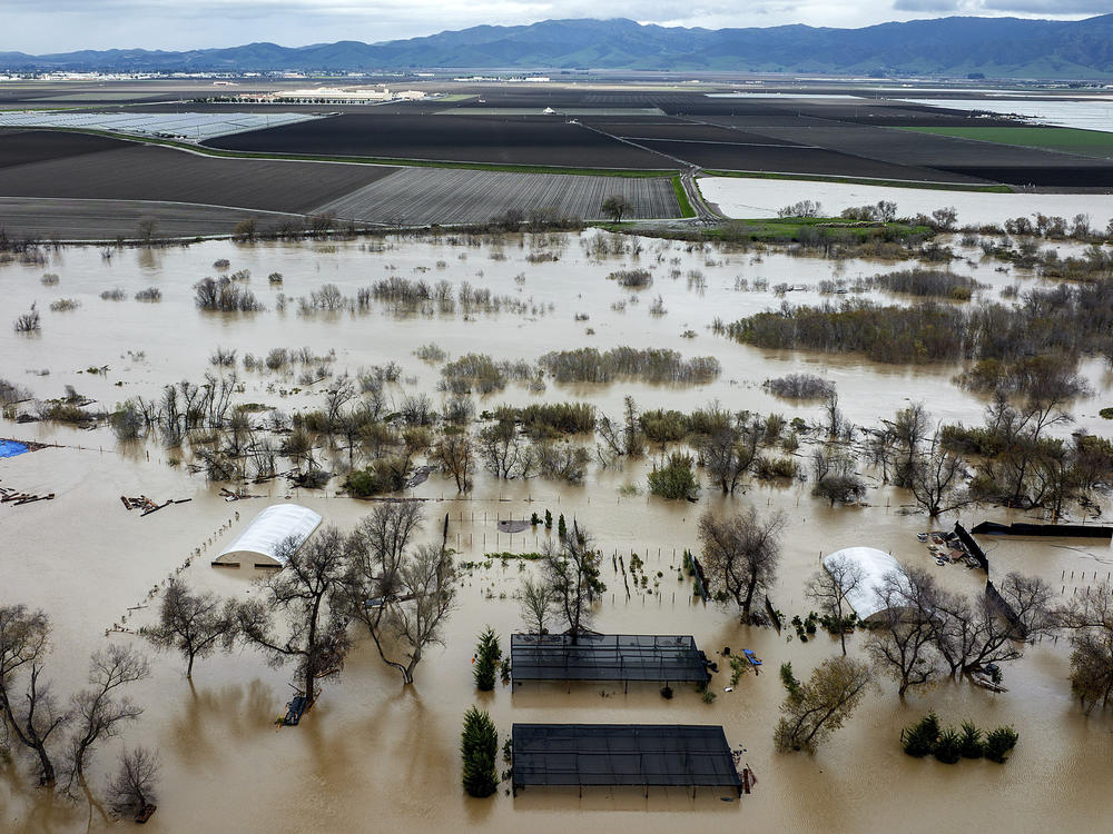 Floodwaters cover a property along River Rd. in Monterey County, Calif., as the Salinas River overflows its banks on Jan. 13, 2023.