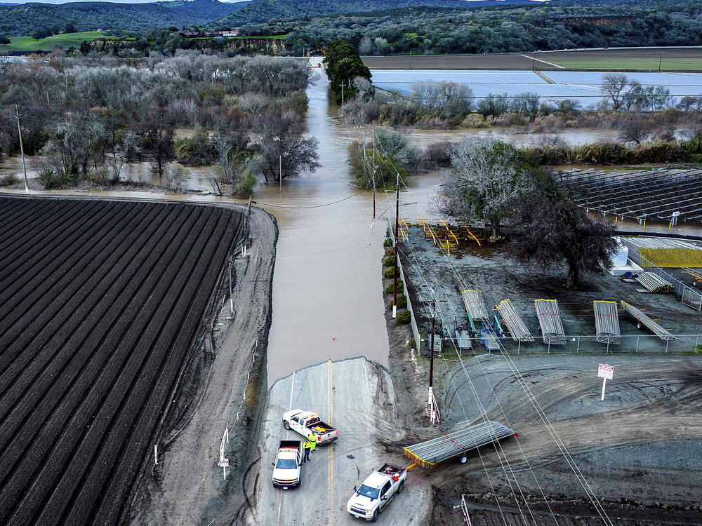 Floodwaters cover South Davis Road near Salinas in Monterey County, Calif., as the Salinas River overflows its banks on Jan. 13, 2023.