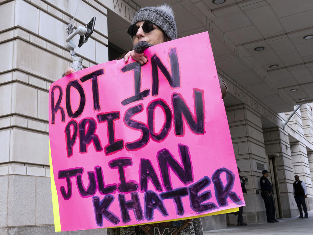 Brianne Chapman protests outside the federal courthouse in Washington, D.C., on Friday, during the sentencing hearing for Julian Khater and George Tanios. Khater pleaded guilty to assaulting Capitol Police Officer Brian Sicknick with pepper spray on Jan. 6, 2021.