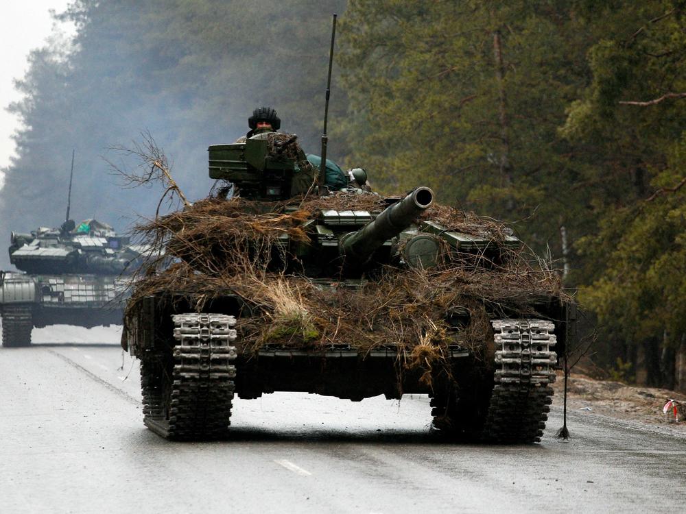 Ukranian tanks move on a road before an attack in Lugansk region on February 26, 2022.