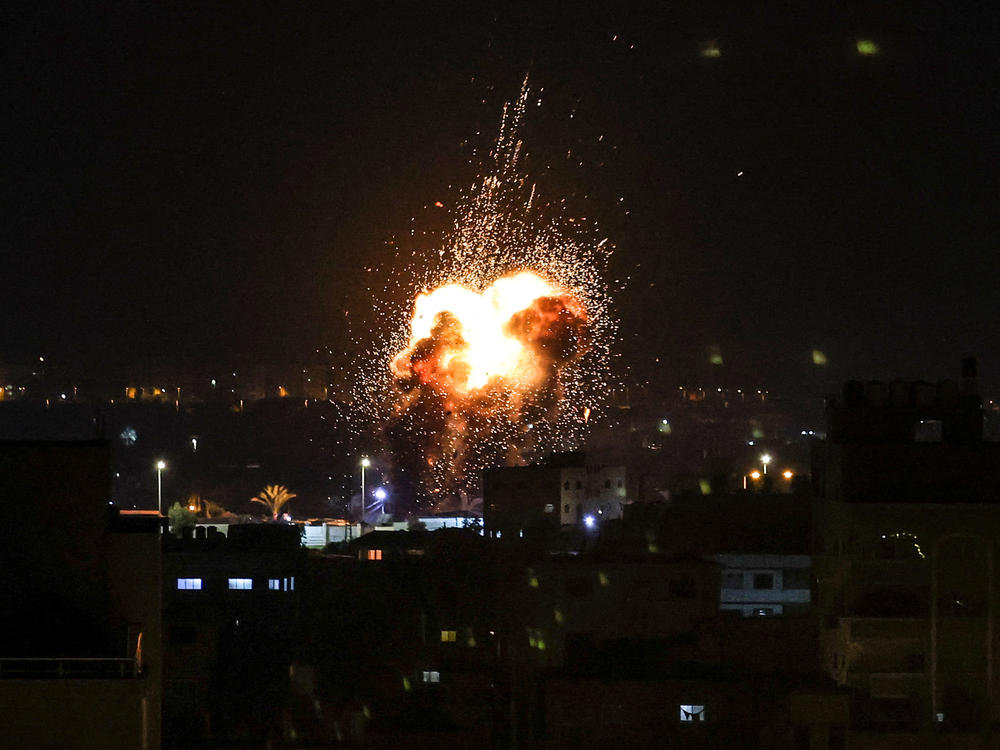 Fire and smoke rise above buildings in Gaza City as Israel launched airstrikes on the Palestinian enclave.